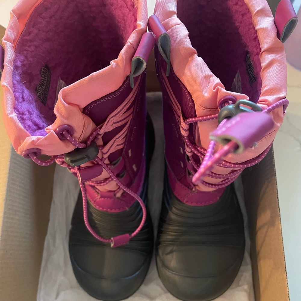 Merrell kids snow boots.  New in box.  Berry color. Smoke free, pet free home.